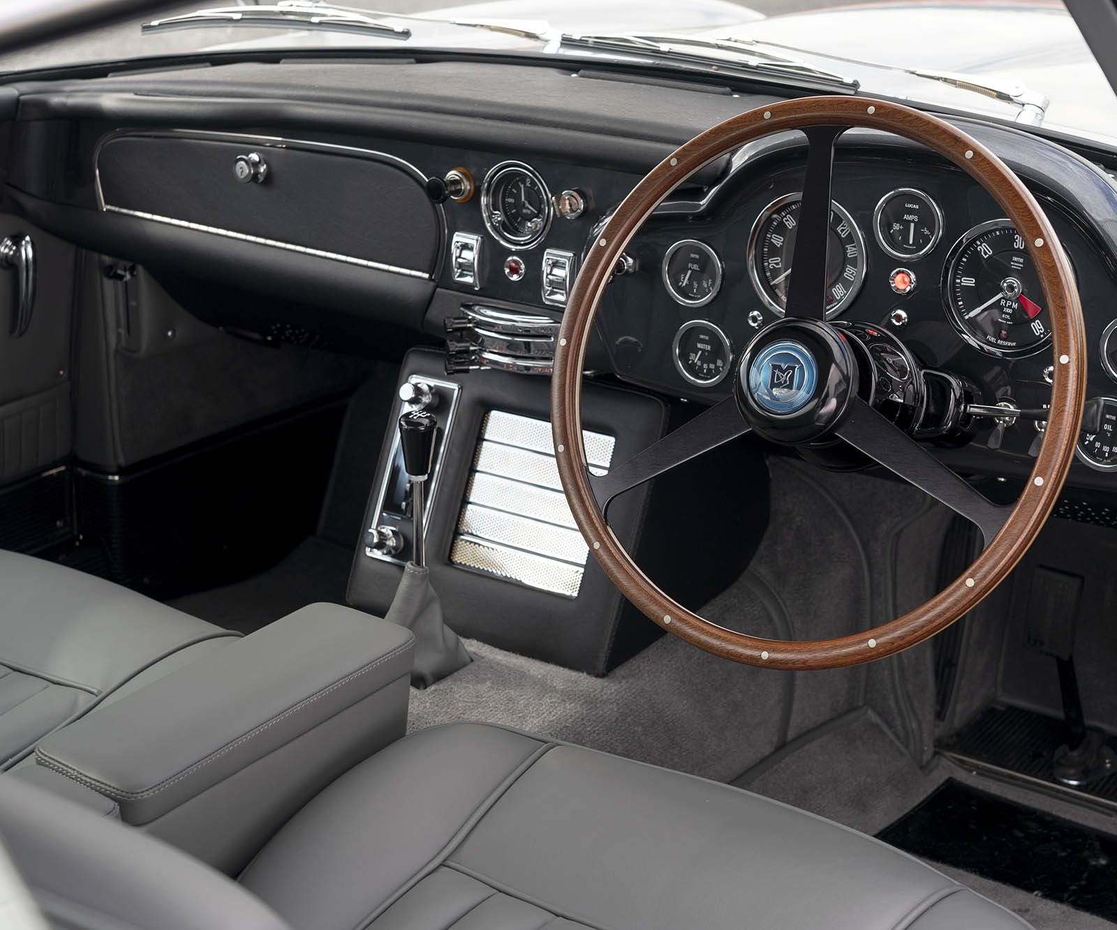 interior of a classic car with grey leather
