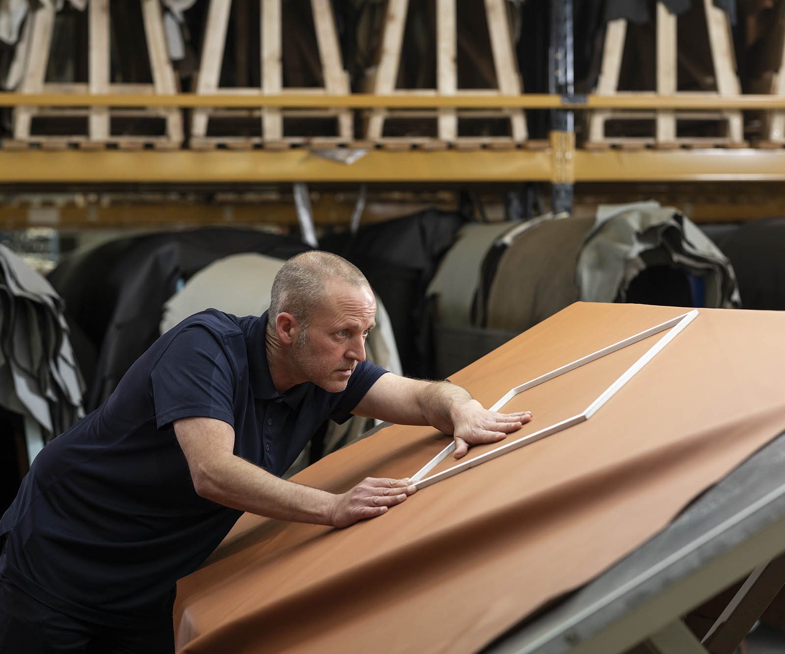 Man inspecting a leather hide