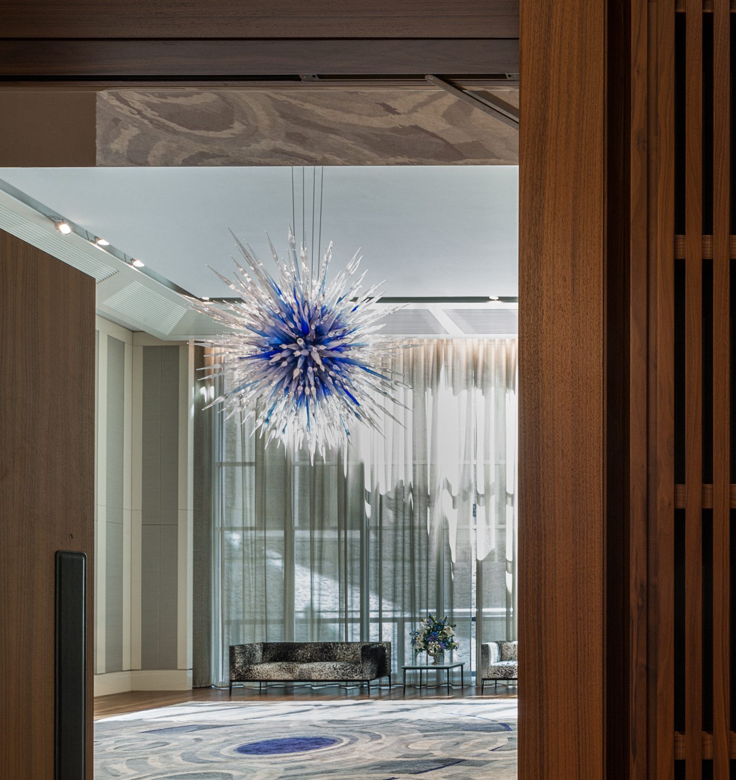 reception room with a large spiked blue glass sculpture