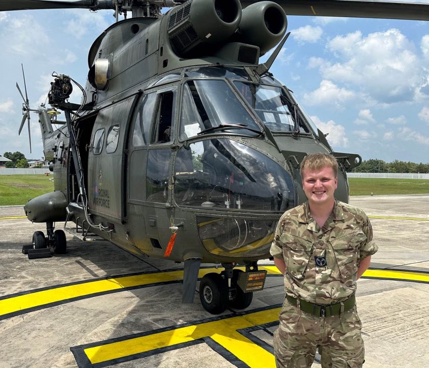 helicopter and man in military fatigues