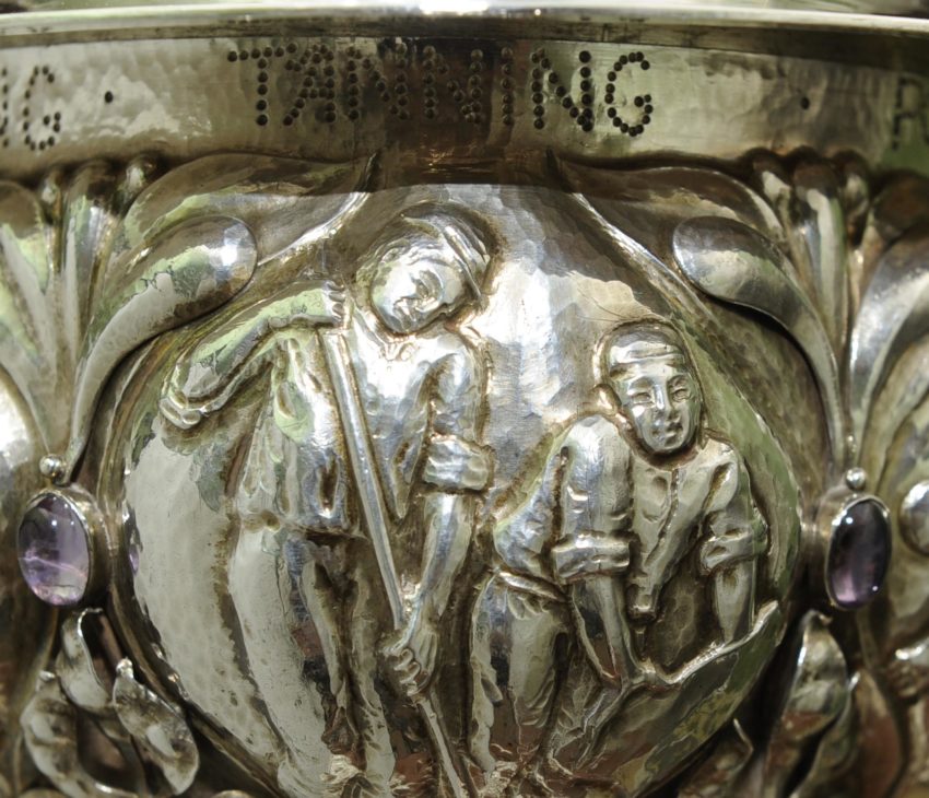 silver engraved with scenes of leather production