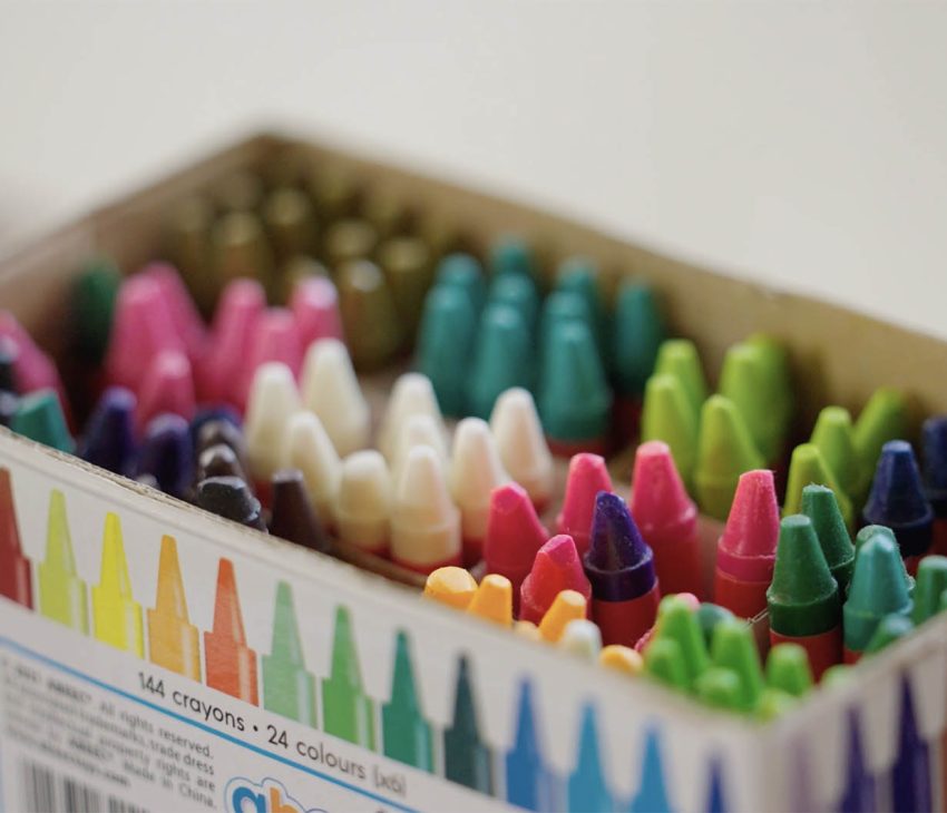 A pack of multi-coloured crayons