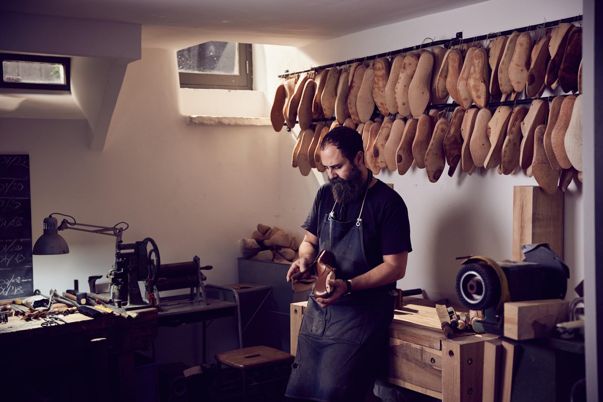 Man in a workshop making shoes