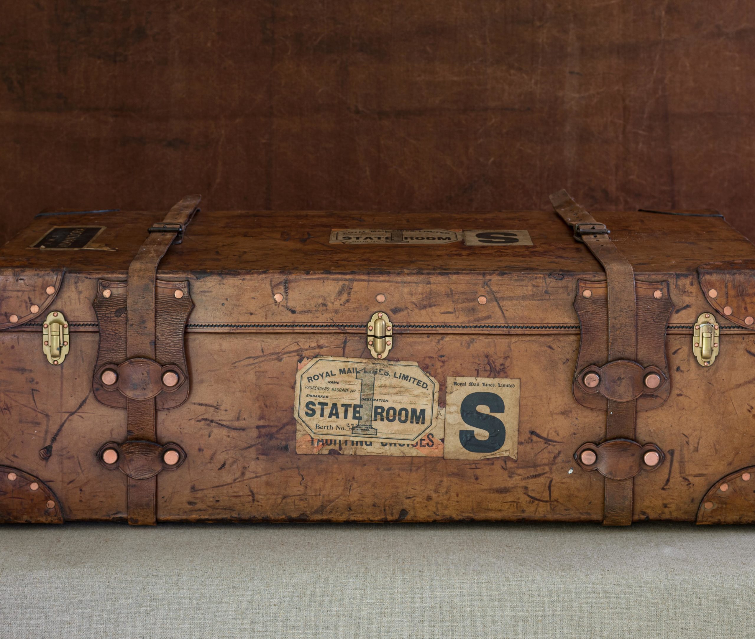 a leather cabin trunk