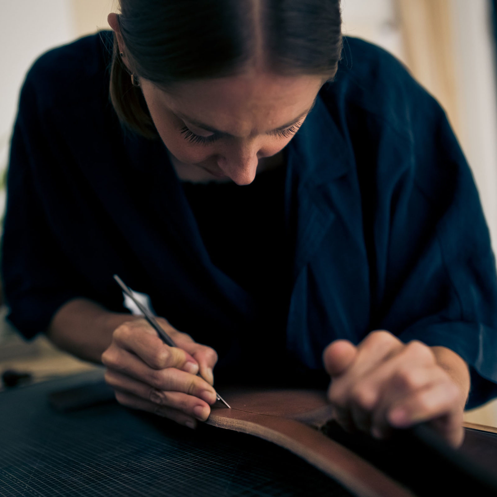 woman working on leather