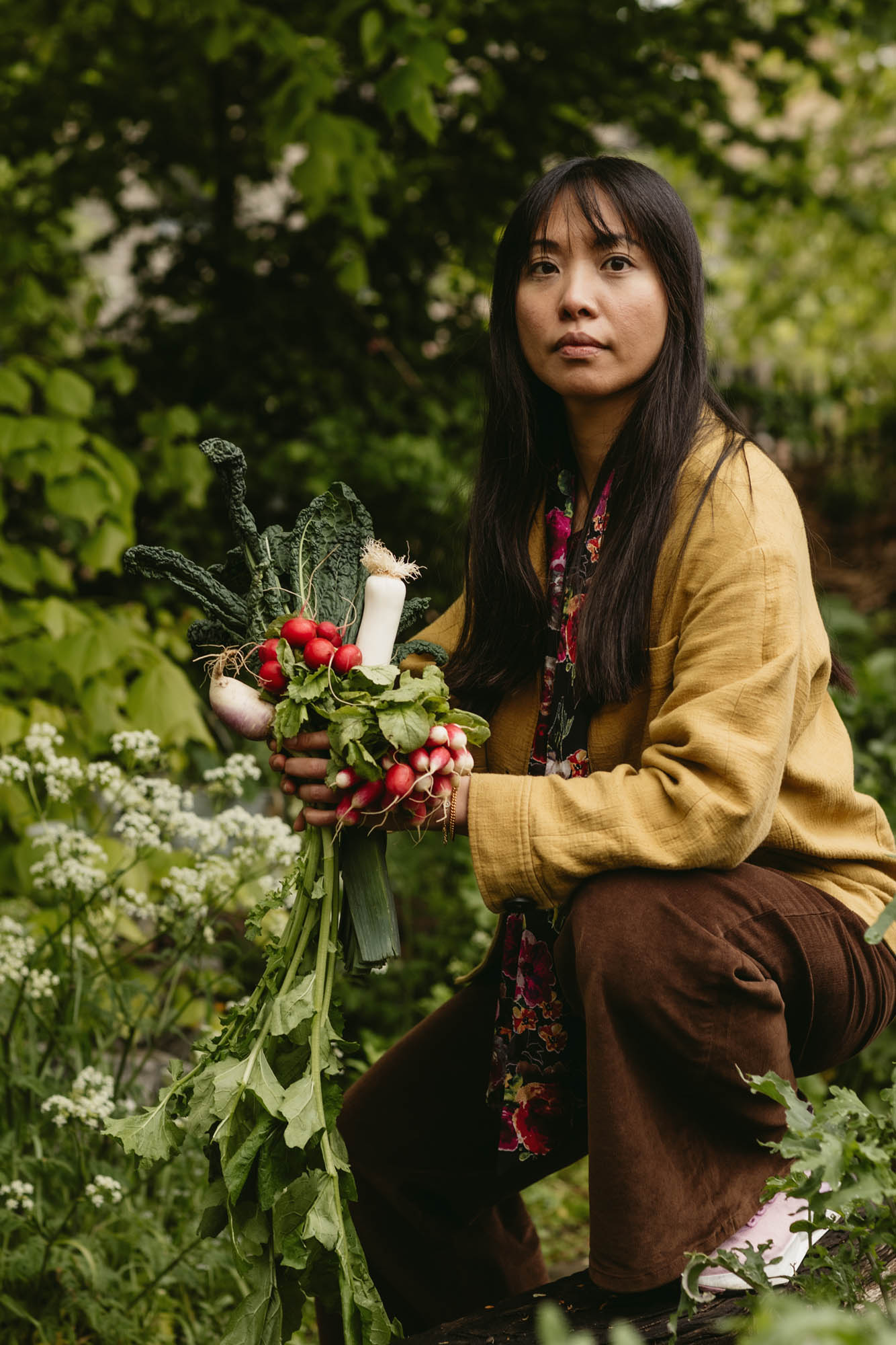 woman holding vegetables