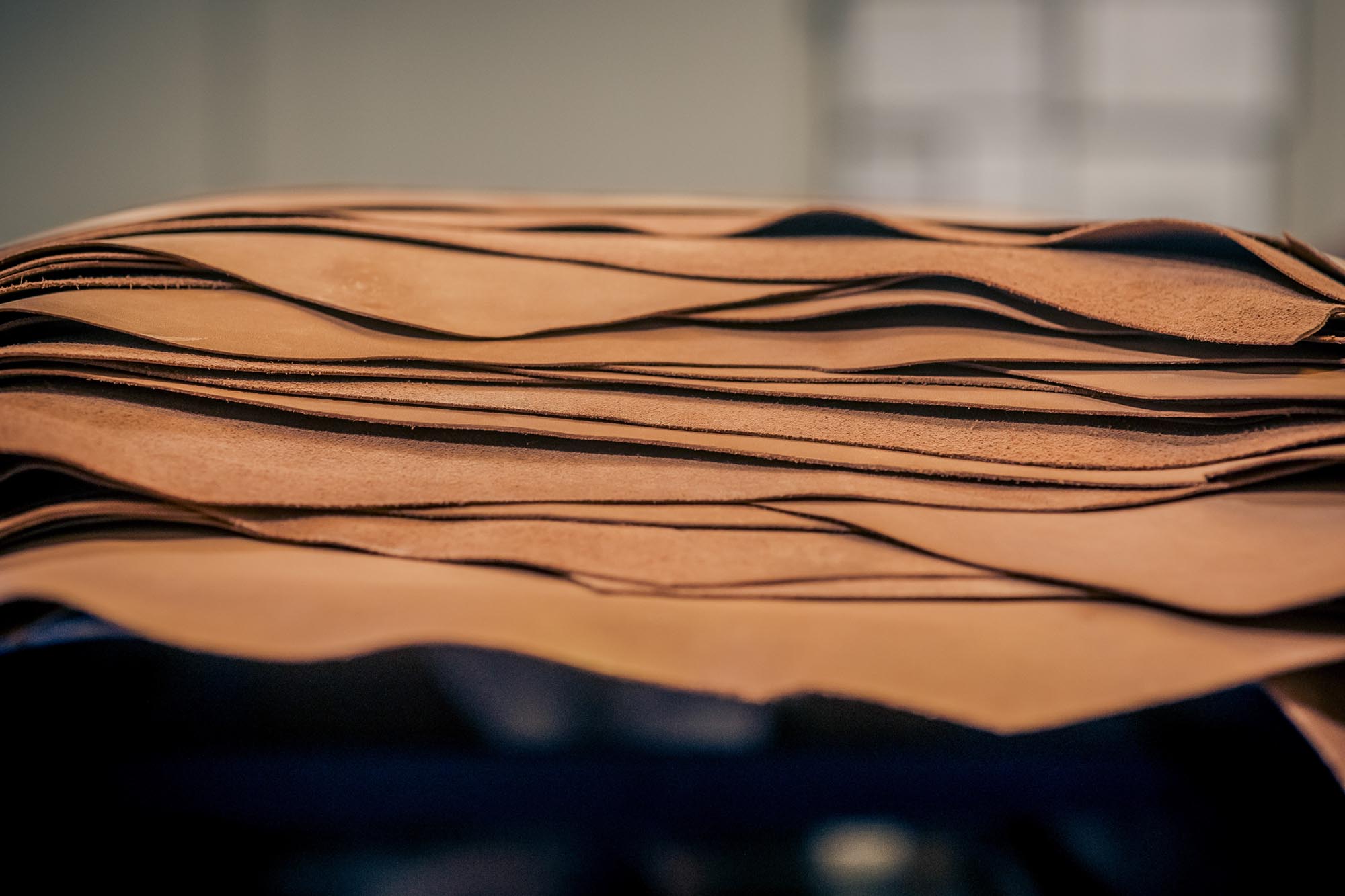 leather hides stacked on top of each other