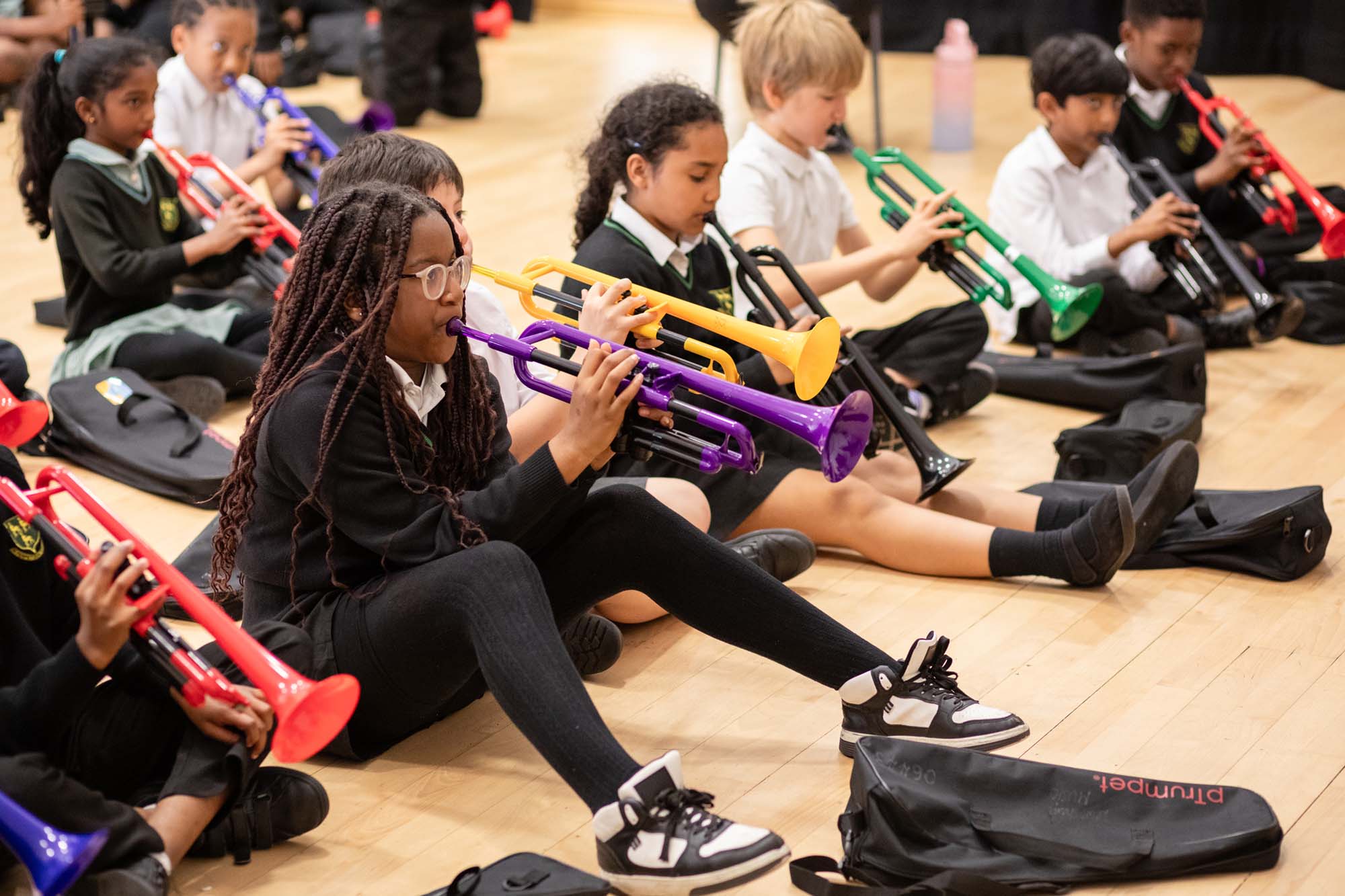 schoolchildren playing trumpets