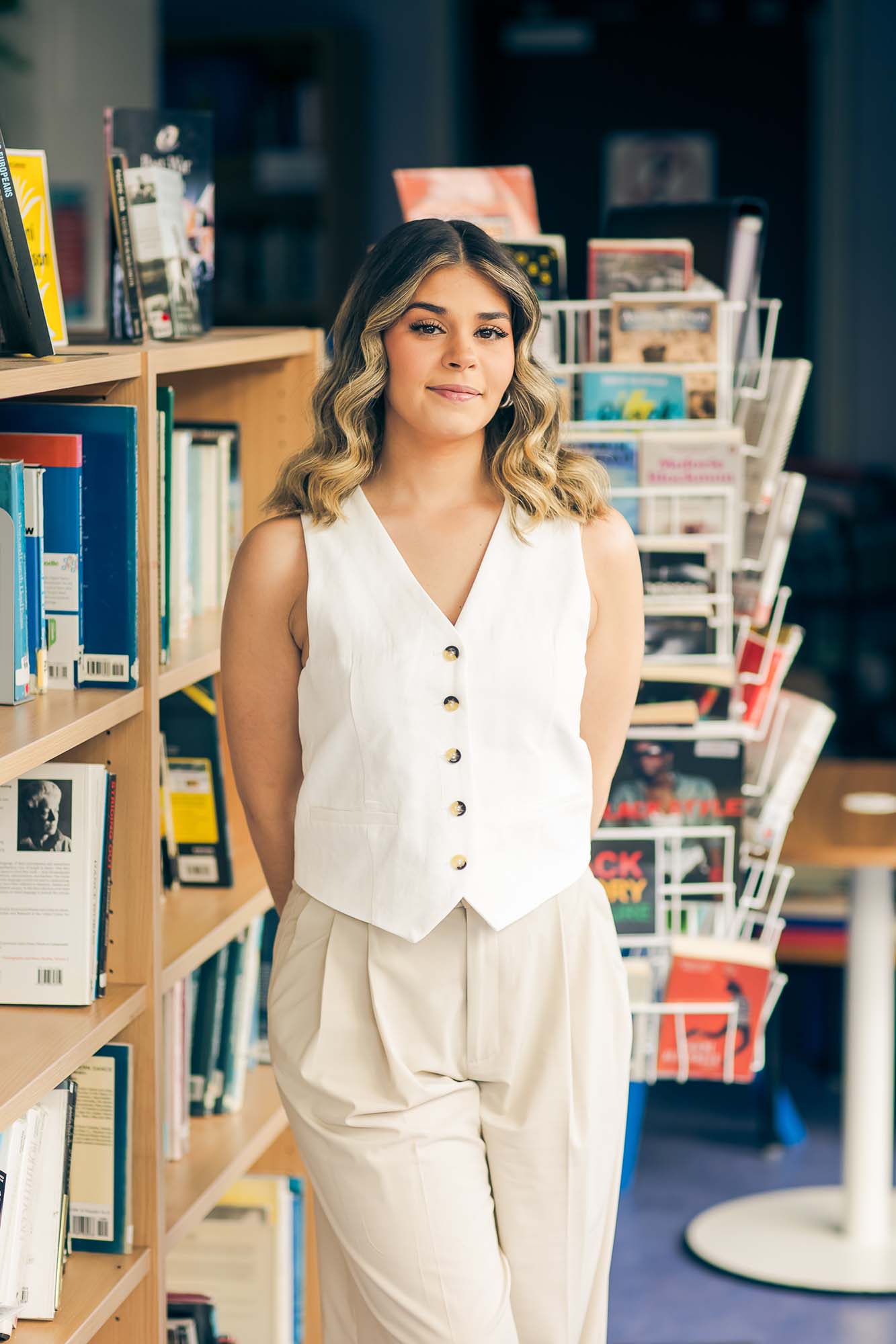 woman standing in a library