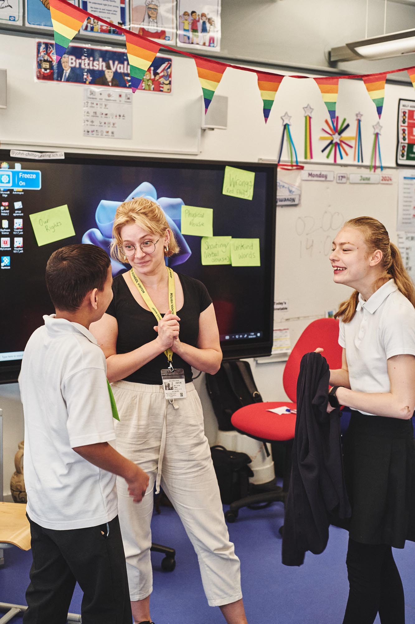 woman in a class room with children