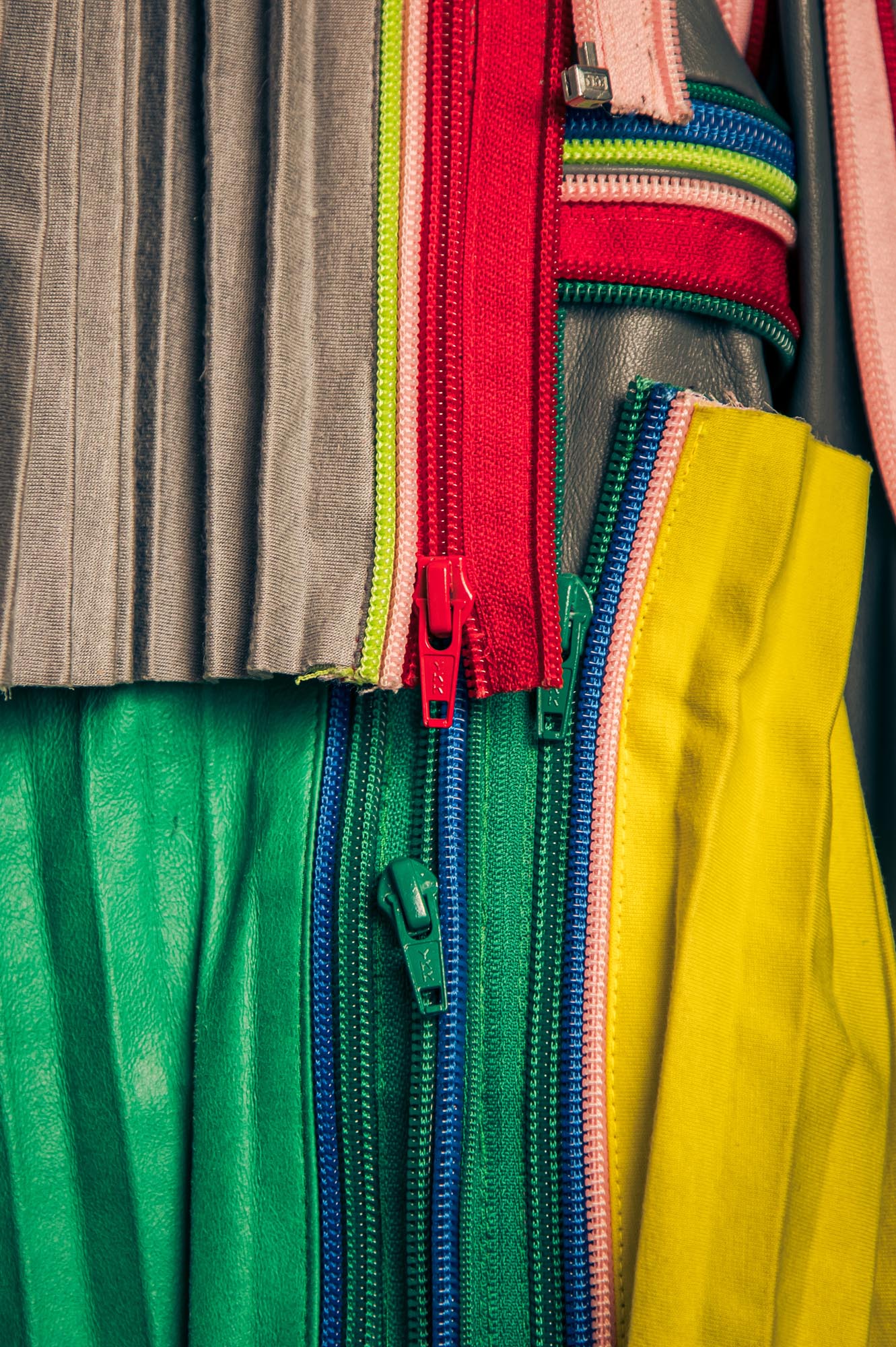 coloured strips of leather with zips