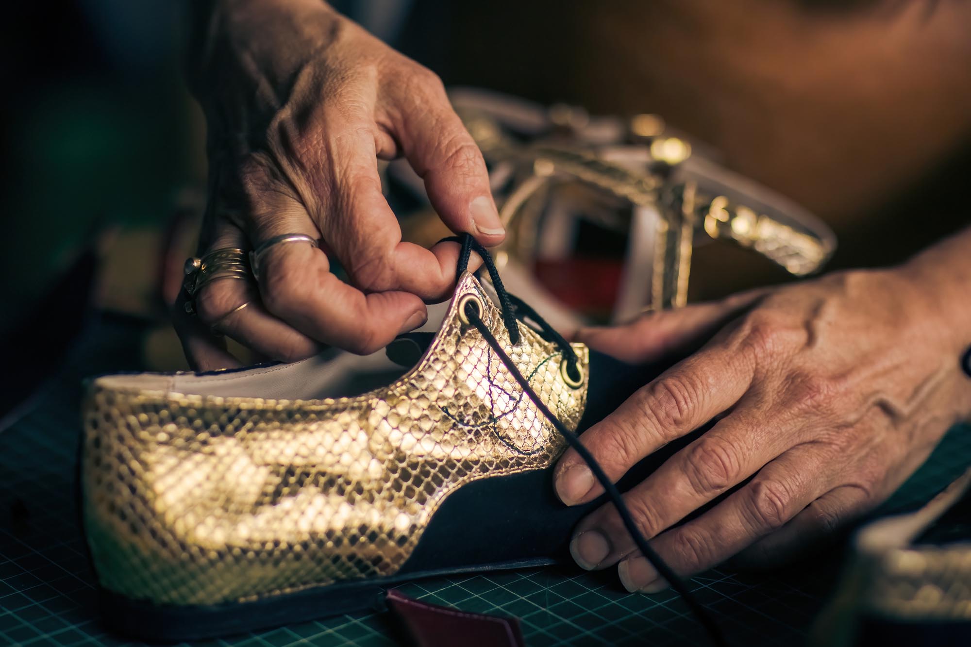 woman making shoes