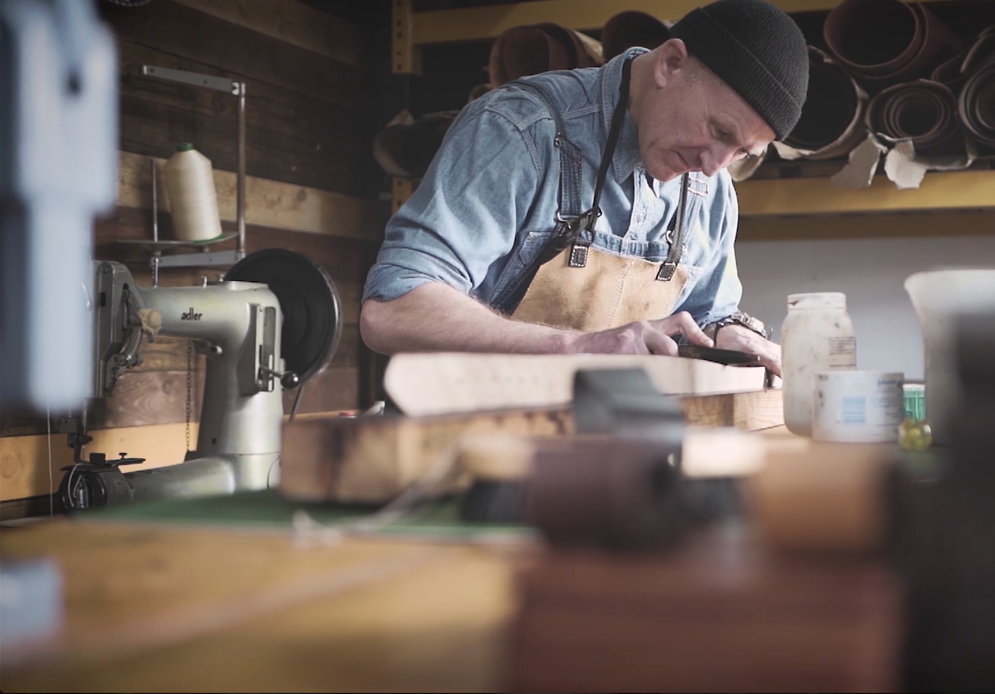 man making a leather belt