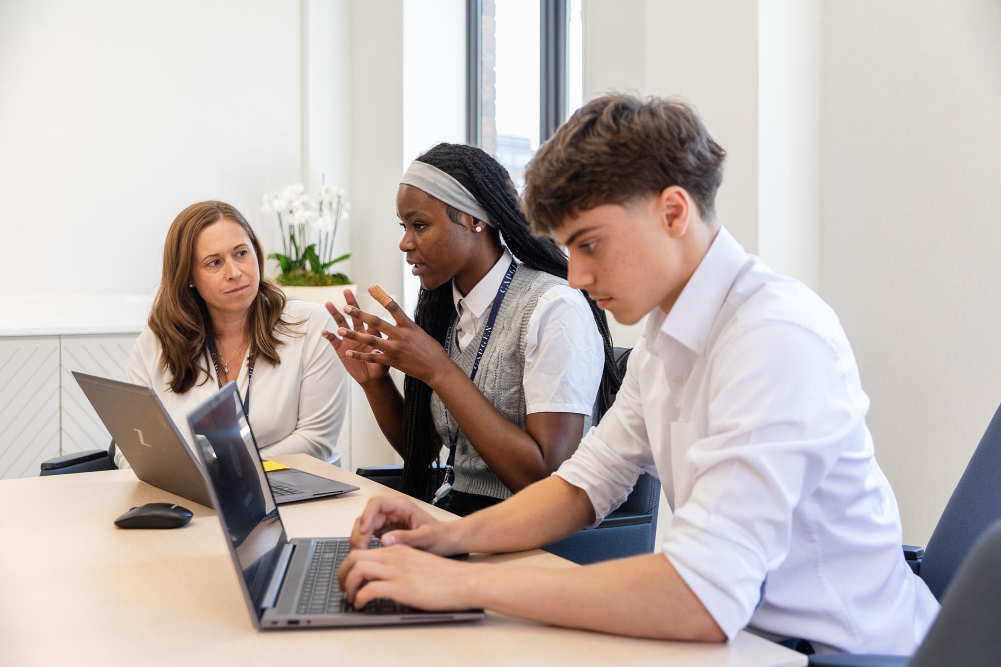 boy and girl working on laptops